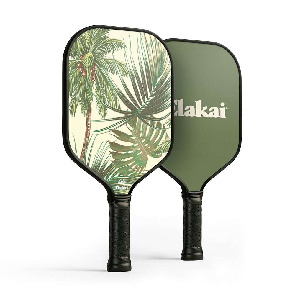 Two pickleball paddles with one featuring a tropical leaf design and the other displaying the brand 'Clakai'.