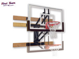 Wall-mounted basketball hoop with backboard and rim on a white background, featuring 'First Team' branding.