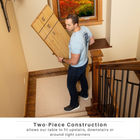 Man carrying a large wooden table up a staircase with text about two-piece construction.