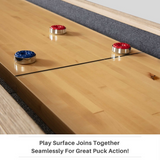 Wooden shuffleboard table with red and blue pucks on a light wood finish.