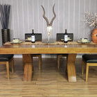 A BBO The Helmsley Poker Table with Dining Top and four chairs in a decorated room.