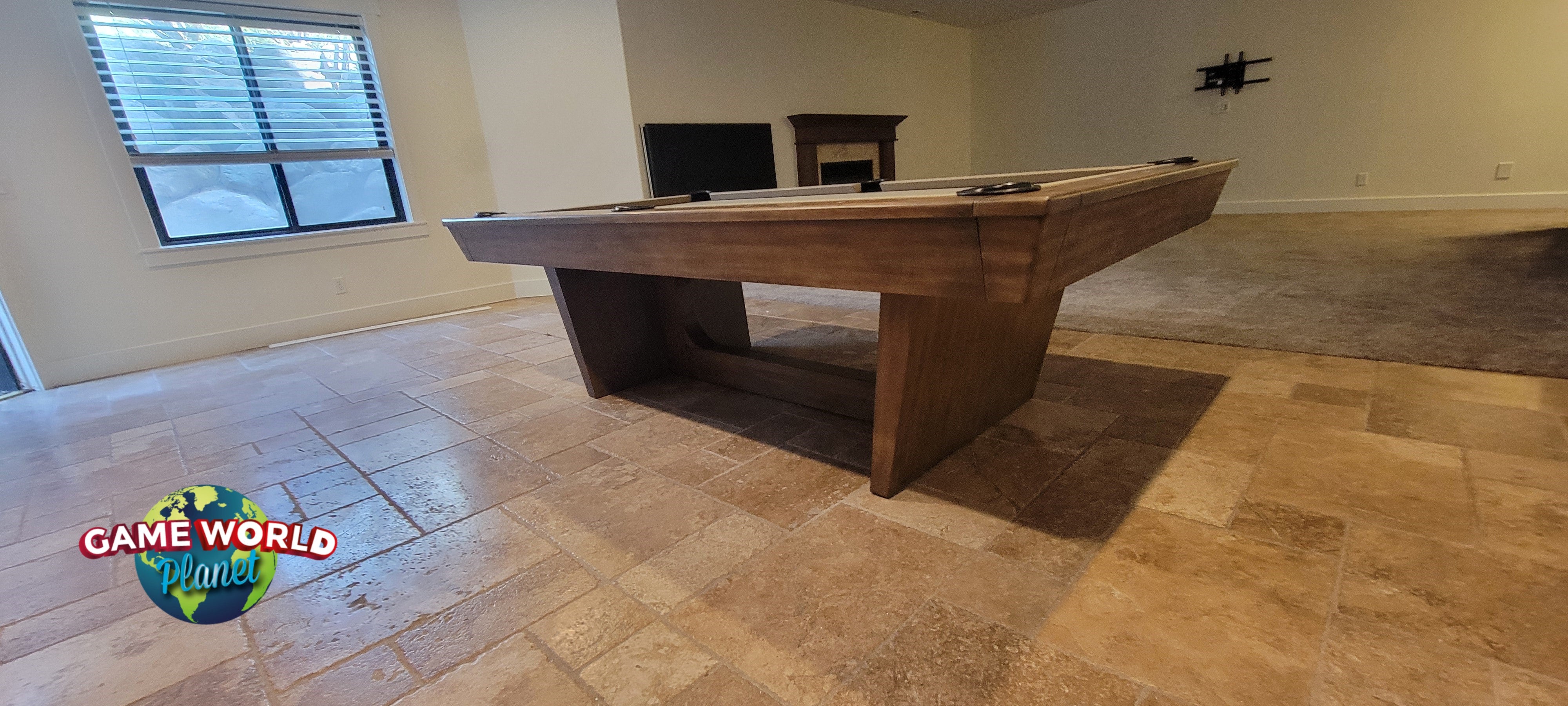 The Nixon KAI 8' Slate Pool Table by Nixon Billiards stands in a spacious, unfurnished room.