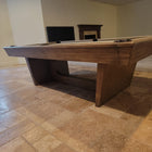 The Nixon KAI 8' Slate Pool Table by Nixon Billiards stands in a spacious, unfurnished room.