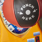 Close-up of a Kalkomat Boxer Dynamic Boxing Game with "Punch Here" printed on the bag.