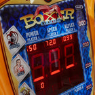 Close-up of Kalkomat Boxer Dynamic Boxing Game arcade with digital score and card images.