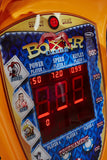 Close-up of Kalkomat Boxer Dynamic Boxing Game arcade with digital score and card images.