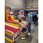 People playing arcade games in a casual setting