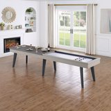 Shuffleboard table in a living room with a fireplace and large window.