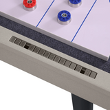 Close-up of a gaming table with control buttons and game pieces.