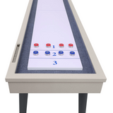 Shuffleboard table with numbered and color-coded pucks on a white background
