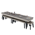 Long dining table with benches and tableware on a white background