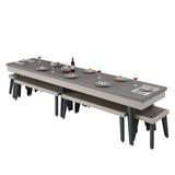 Long dining table with benches and tableware on a white background