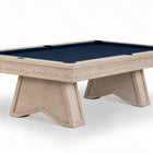 A modern pool table featuring a light beige wood frame and legs with a dark navy blue felt surface, shown on a clean white background.