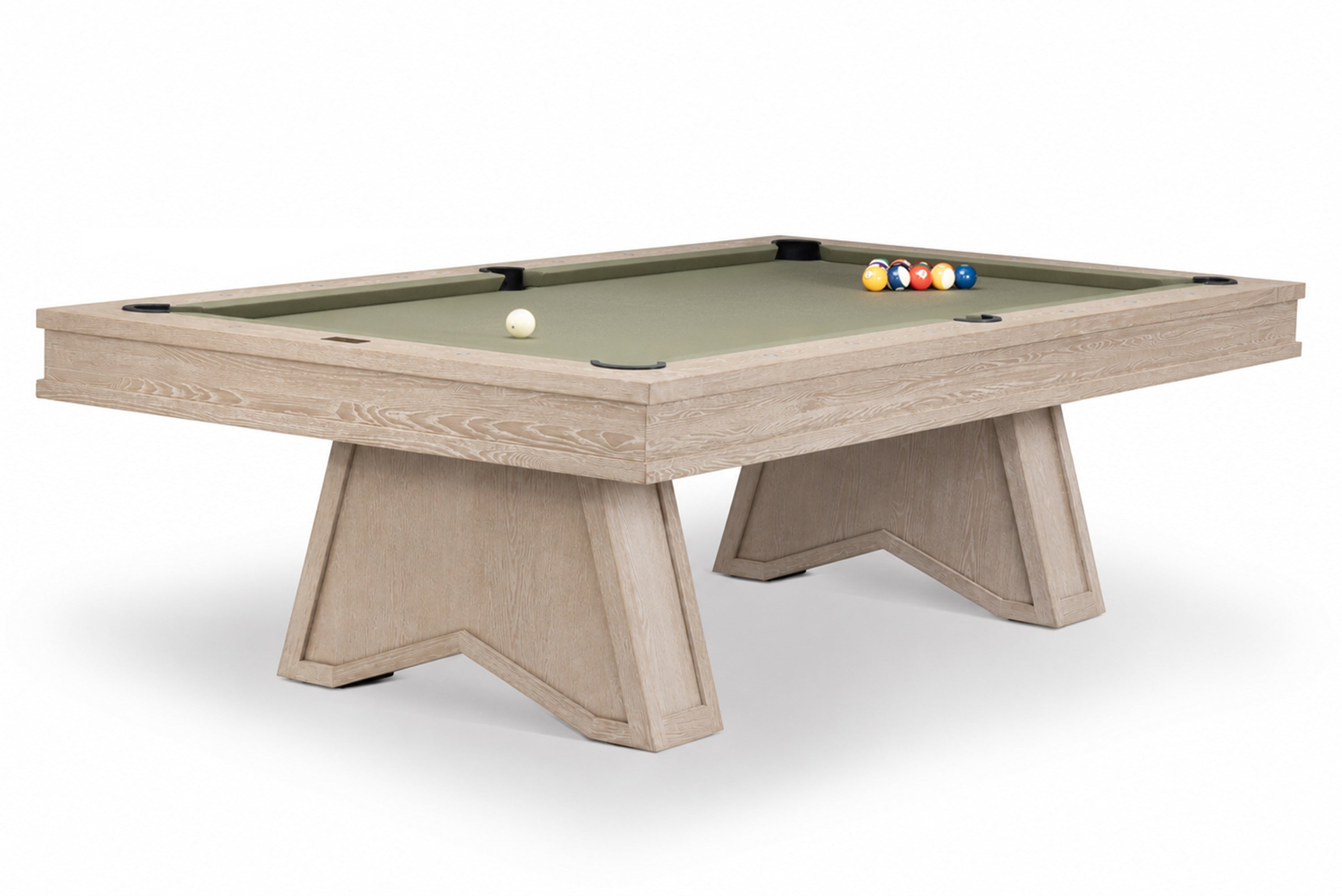 A modern pool table with a light oak wood frame and a sage green felt surface, shown on a clean white background with a few billiard balls on the table.