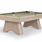 A modern pool table with a light oak wood frame and a sage green felt surface, shown on a clean white background with a few billiard balls on the table.