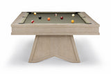 A modern pool table with a light oak wood frame and a dark green felt surface, shown on a clean white background with several billiard balls scattered on the table.