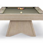A modern pool table with a light oak wood frame and a green felt playing surface, featuring a geometric triangular base and racked billiard balls on a white background.