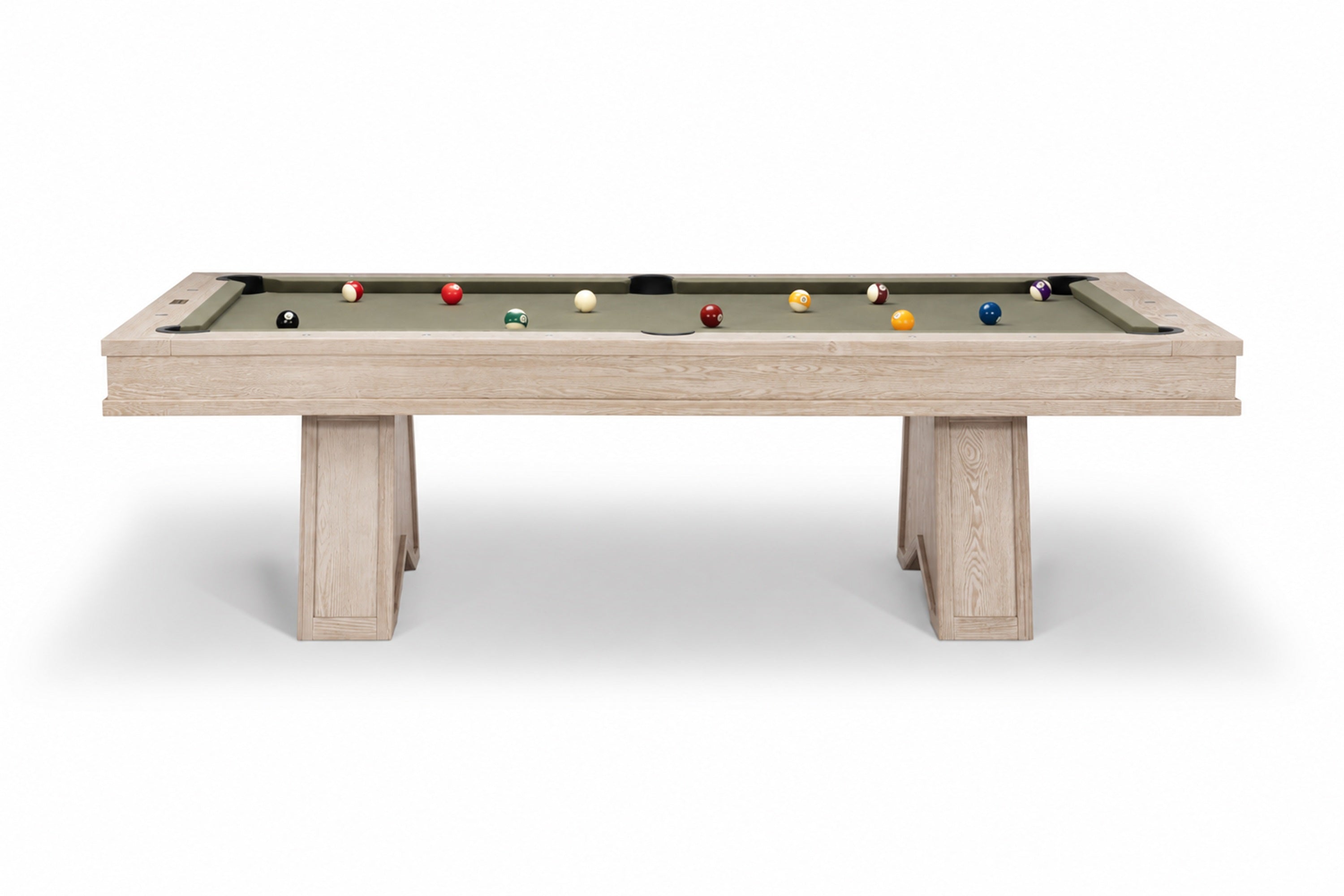 A modern pool table with a light natural wood frame and a green felt playing surface, shown with several billiard balls on a clean white background.