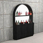 RAM Game Room Prohibition Back Bar in black displays liquor with vintage style against concrete wall.