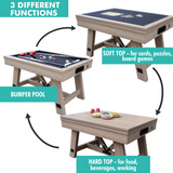 Multi-functional table with different tops for pool, cards, and food.
