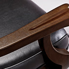 Close-up of wooden armrest and black leather seat on Brunswick Centennial Game Table in Espresso.