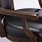 Brunswick Billiards Centennial Game Table in Espresso with black leather-cushioned wooden chairs.