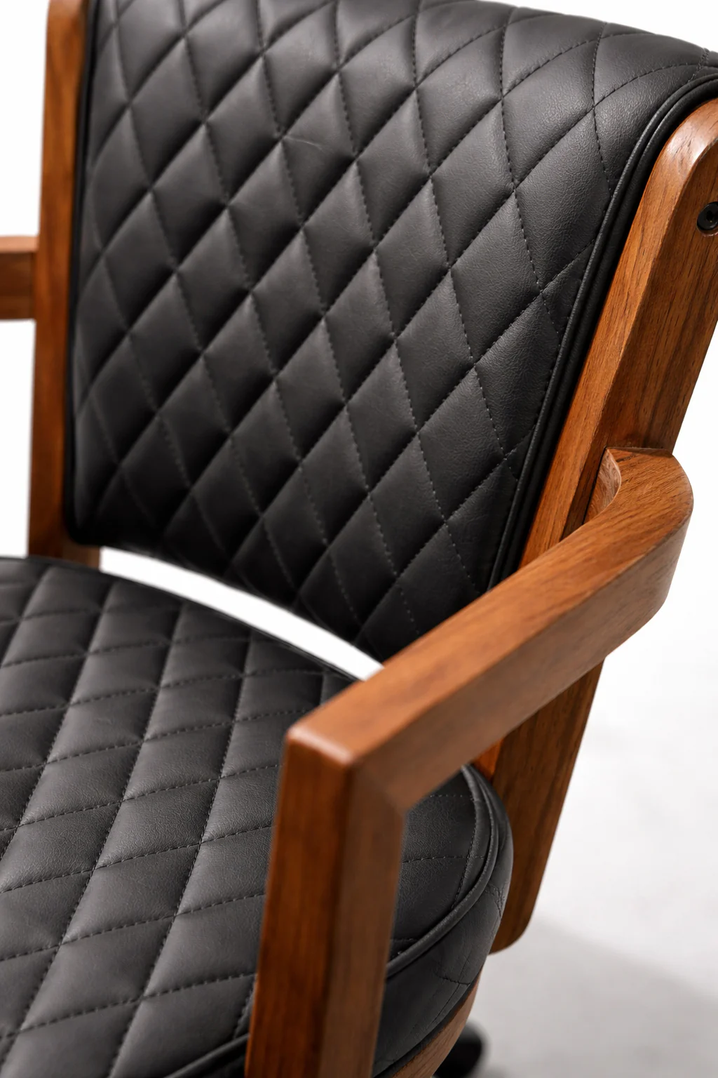 Chair with black quilted cushion on a white background
