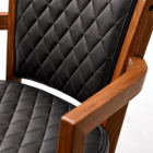 Chair with black quilted cushion on a white background