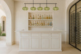 A minimalist home bar with the RAM Game Room 84" Bar in antique white and a wine wall on the right.
