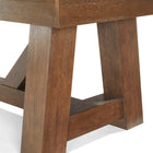Close-up of angled wood legs on Brunswick Billiards Botanic 12' Shuffleboard Table, Rustic Brown.