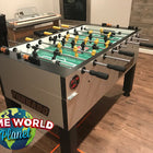 Tornado Tournament Competition T-3000 Foosball Table in silver, shown in a game room setting.