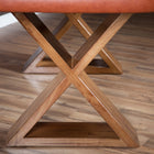 Close-up of BBO Poker Tables' Helmsley Poker Table X-base on a wood floor.