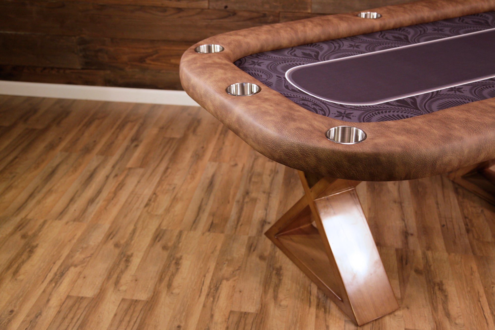 BBO The Helmsley Poker Table with Dining Top by BBO Poker Tables on a wood floor by a wood wall.