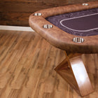 BBO The Helmsley Poker Table with Dining Top by BBO Poker Tables on a wood floor by a wood wall.
