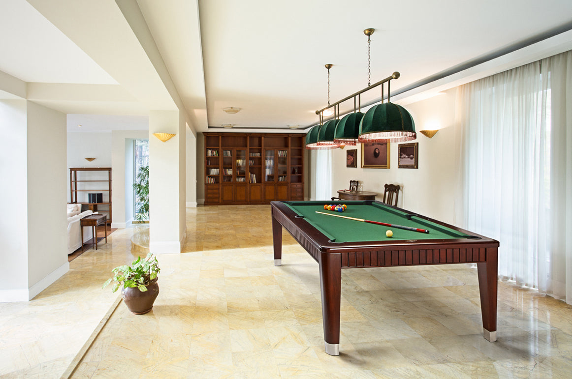 A spacious room with a Brunswick Henderson 8' pool table, bookshelves, and large windows.