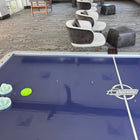 Dynamo 8' Pro Style Air Hockey Table with Dyna-Blast blower and two paddles in lounge area.