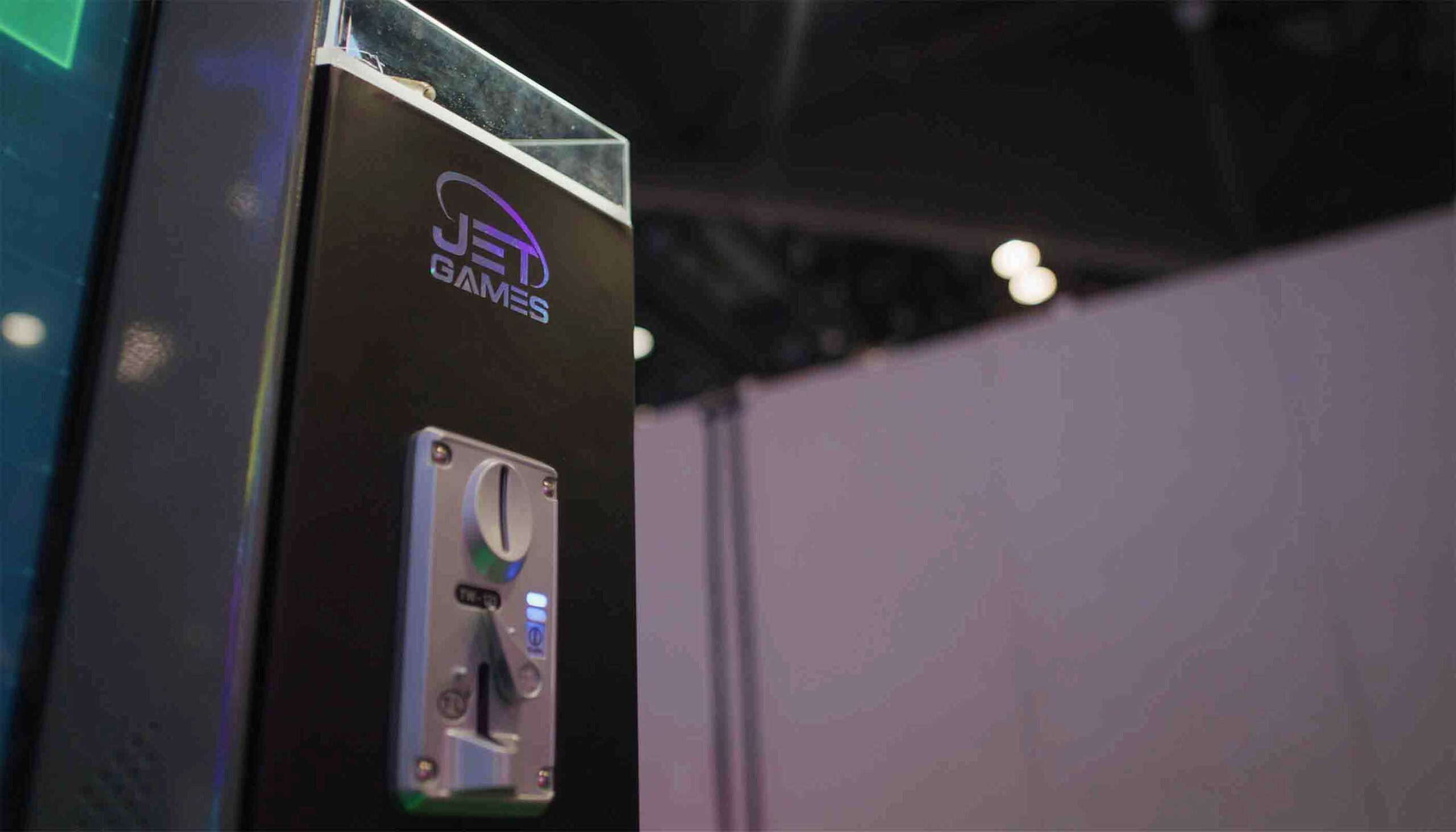 Gaming console with 'JET GAMES' logo on a blurred background