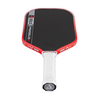 Red and black pickleball paddle with white handle on a white background