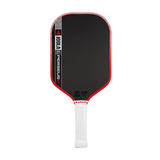 Pickleball paddle with black surface, red edges, and white handle on a white background