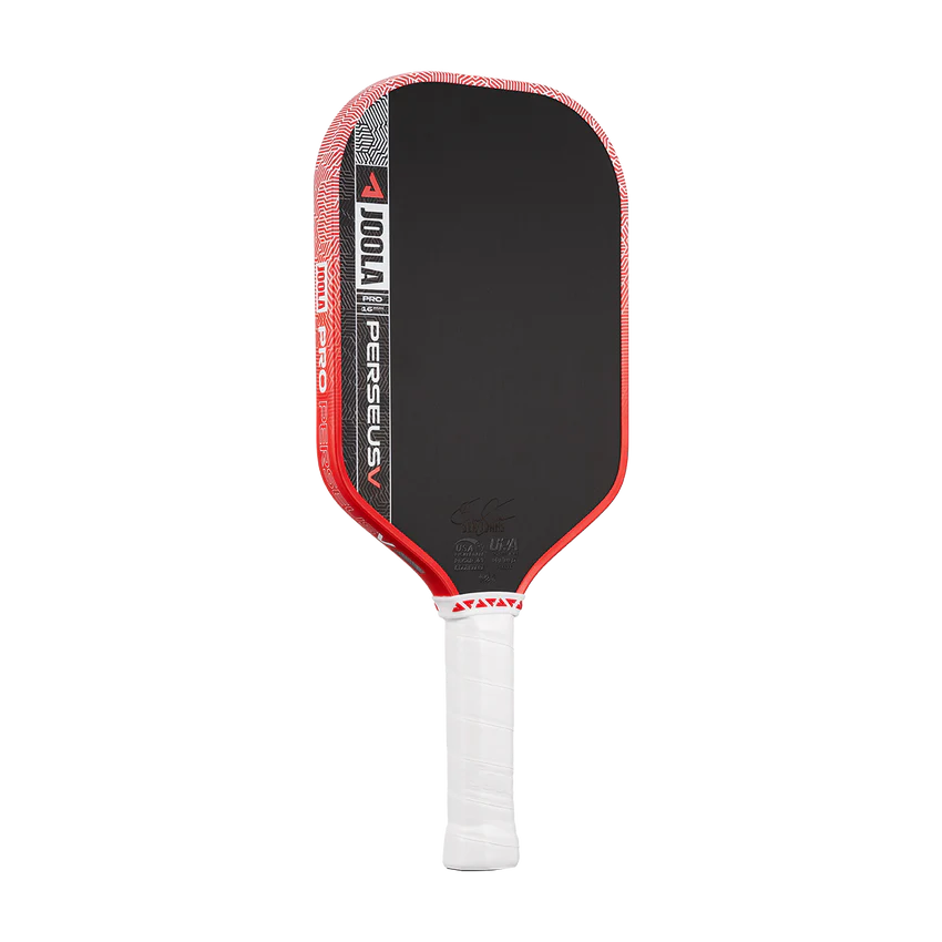 Pickleball paddle with black surface and red edges on a white background