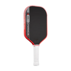 Pickleball paddle with black surface and red edges on a white background