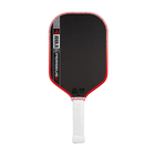 Pickleball paddle with black surface, red edges, and white handle on a white background