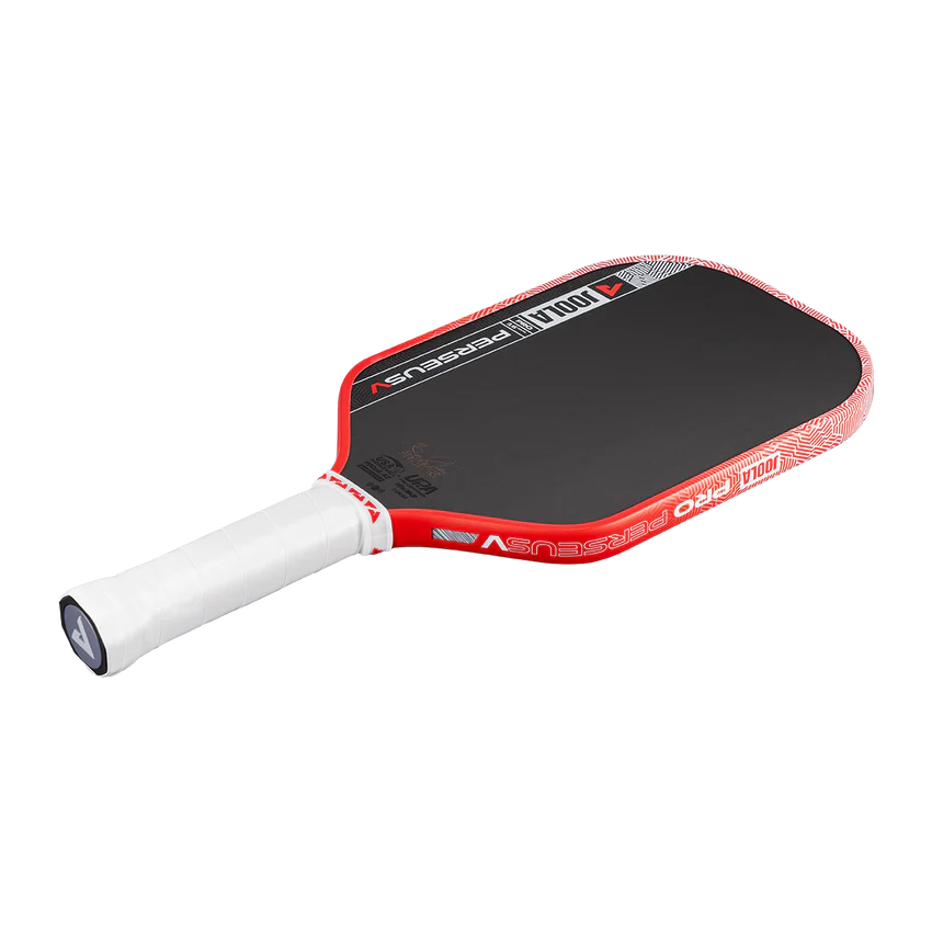 Red and white pickleball paddle on a black background