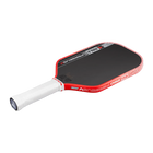 Red and white pickleball paddle on a black background