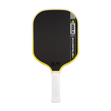 Pickleball paddle with black face, yellow rim, and white handle on a white background