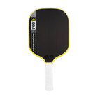 Pickleball paddle with black surface, yellow rim, and white handle on a white background