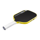 Yellow and black pickleball paddle on a white background