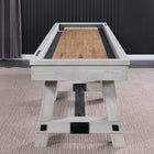 Playcraft 16' Yukon Pro-Style Shuffleboard Table in Northern Drift on carpet, dark wall behind.