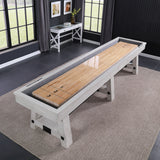 A Playcraft 16' Yukon Pro-Style Shuffleboard Table in Northern Drift sits on a rug in a modern room.