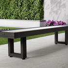 The American Heritage Lanai 9' Outdoor Shuffleboard Table in Obsidian Black sits on the patio.